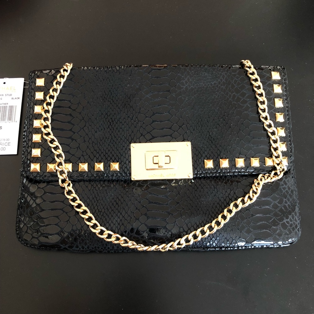 Snake print black clutch